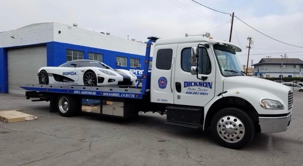 Dickson flatbed transporting a Koenigsegg supercar